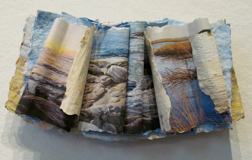 A folded book with pictures on it.