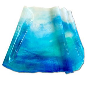 A translucent, pleated skirt with a gradient of blue tones, simulating the colors of the ocean and sky, displayed on a white background.
