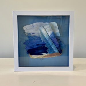 A white frame with a Rolling Waves 9 x 9 x 2 inches piece of paper.