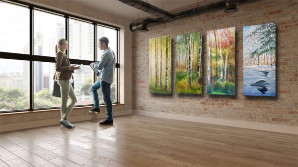 Two people standing in front of a room with Birch trees in Summer, 45 x 20 x 3 inches, 2950.00 on the wall.