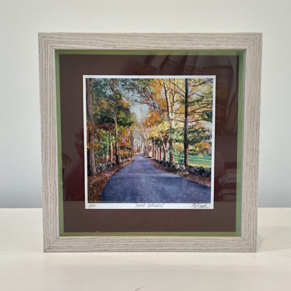 A framed painting of a road in autumn.