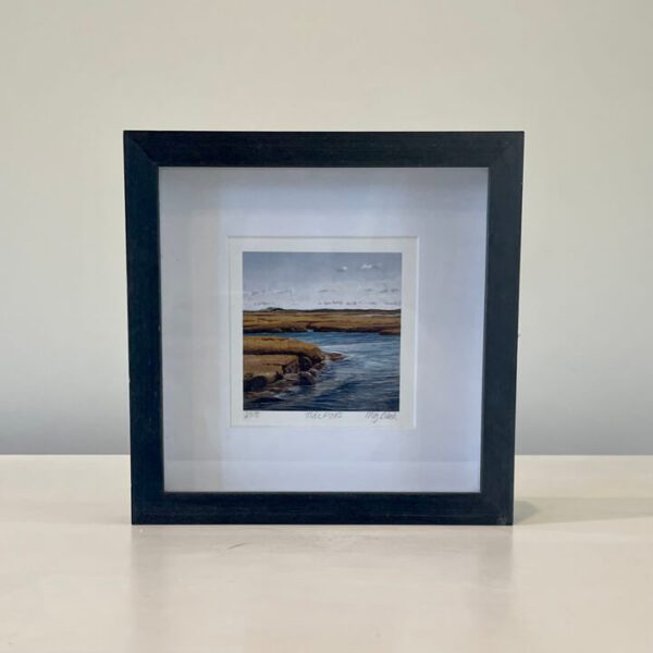 A black frame with a picture of a river.