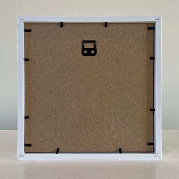A white frame with a black handle on it.