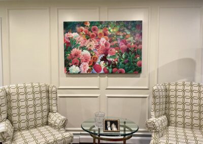 Painting of pink flowers on a wall.