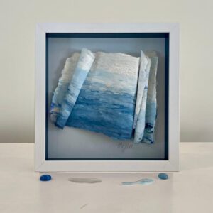 ? Sold, Lisa and Saatchi. Framed blue and white abstract art.
