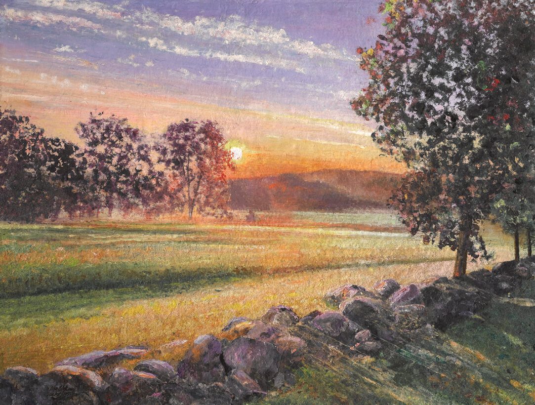 A woman working on a painting.