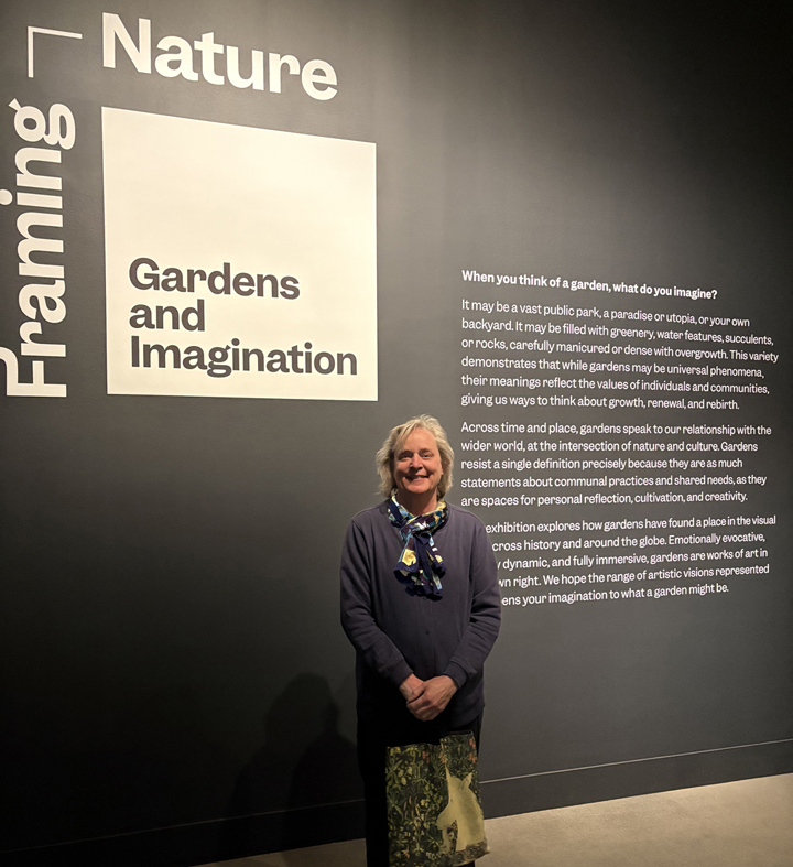 Painting of pink flowers on a wall.